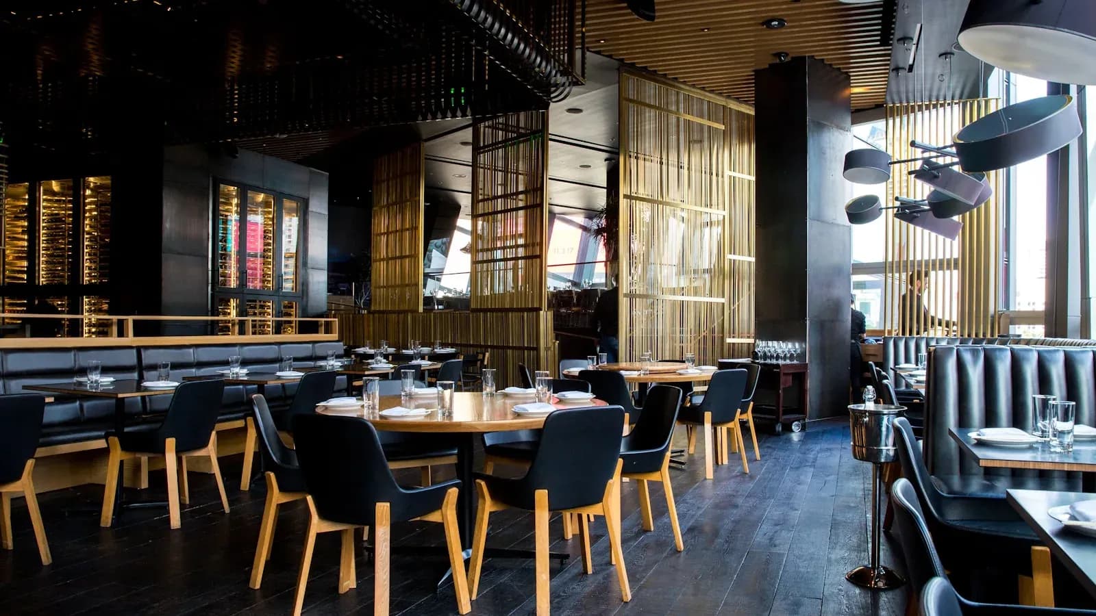 Upscale restaurant interior with exposed brick and warm lighting in Raleigh